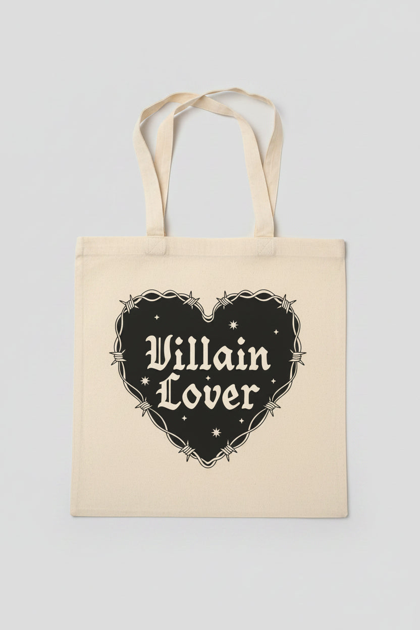 Tote bag with 'Villain Lover' design on a wooden surface