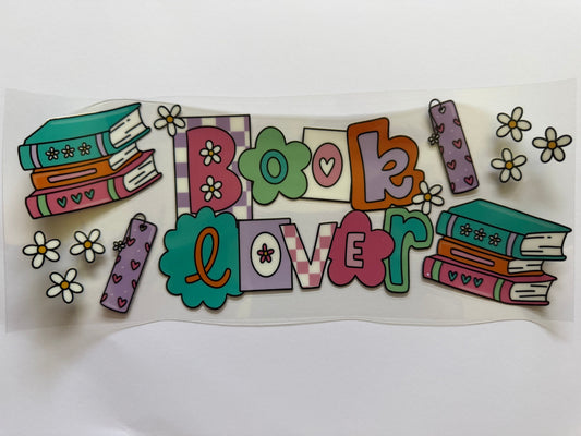 Colorful 'Book Lover' sticker with books and flowers on a white background