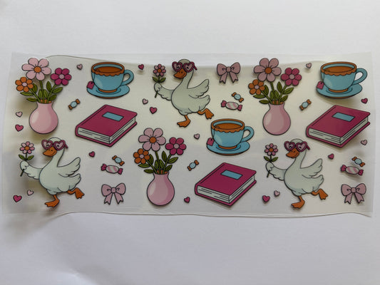Sheet of decorative stickers with ducks, flowers, books, and teacups on a white background.