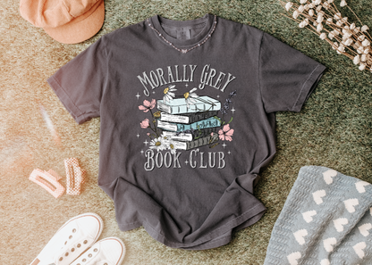 Gray t-shirt with 'Morally Grey Book Club' design on a textured surface.