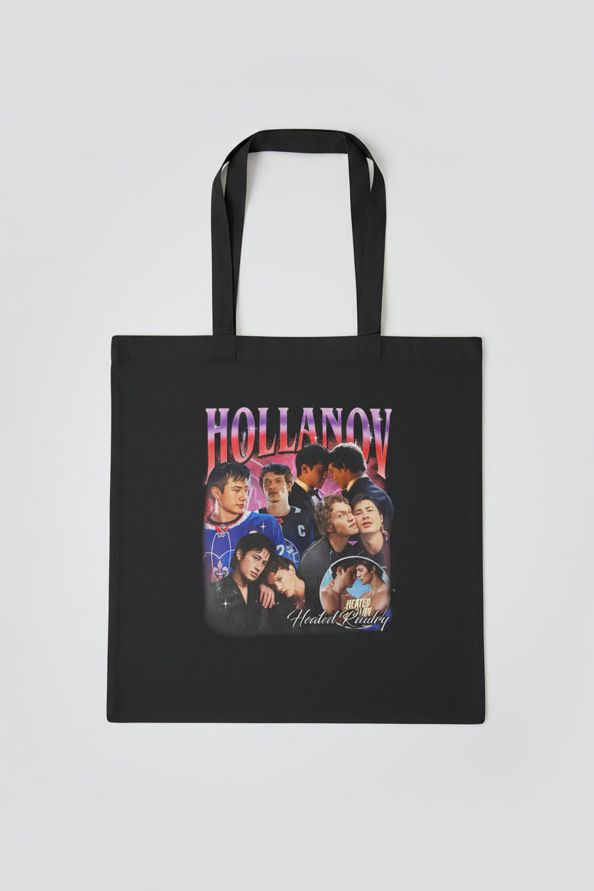 Black tote bag with 'Hollanov' graphic design on a wooden surface